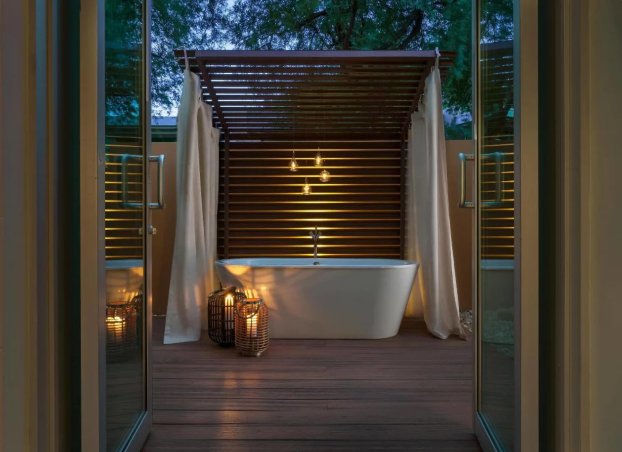 outdoor bathtub at dusk Sanctuary Camelback Mountain romantic resort in arizona